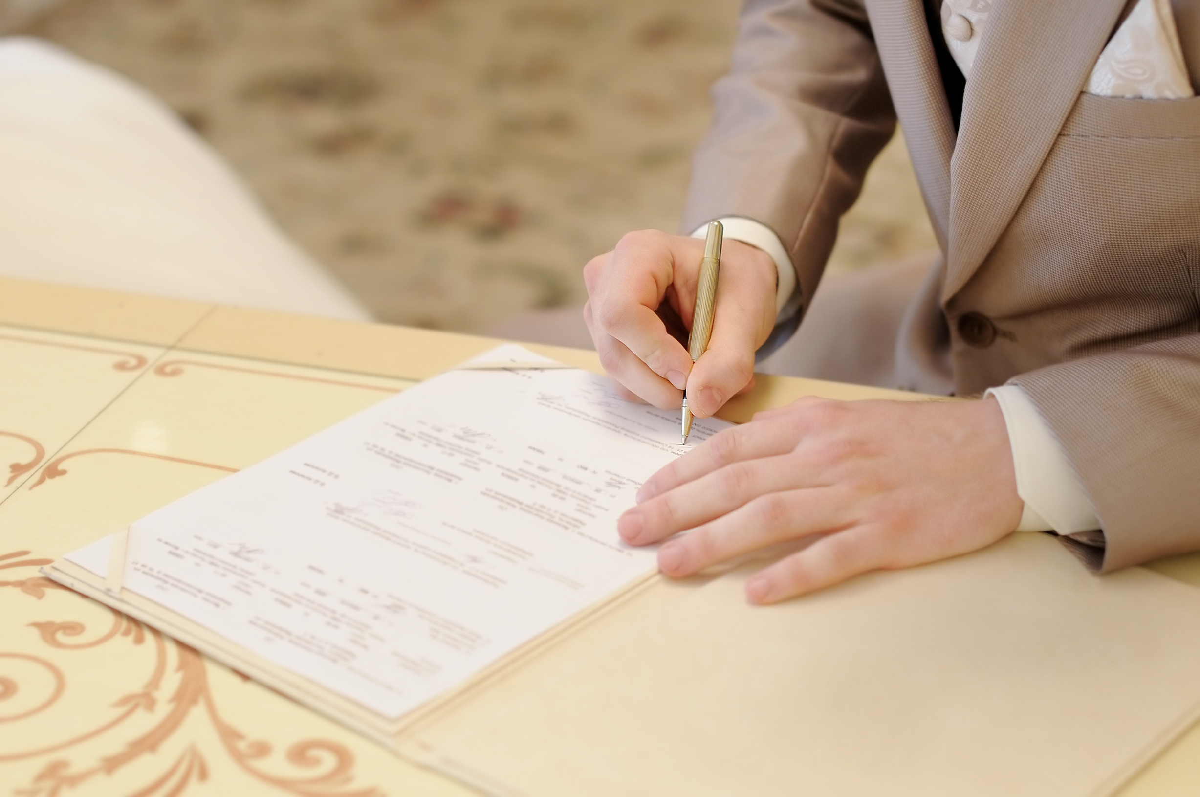 Groom signs Smoky Mountain Wedding Marriage License