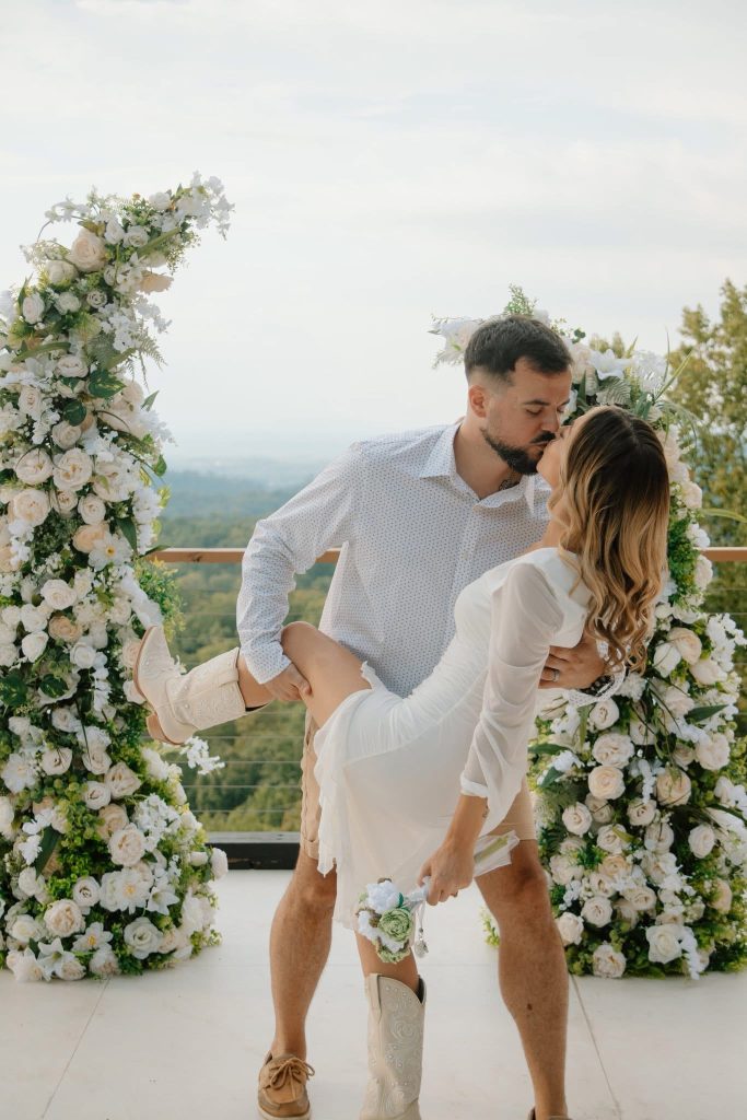 Couple kissing at a wedding - Flowers for Your Smoky Mountain Wedding